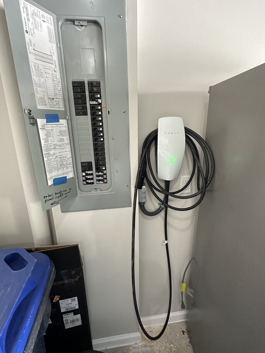 Close-up of Tesla Wall Connector mounting and wiring