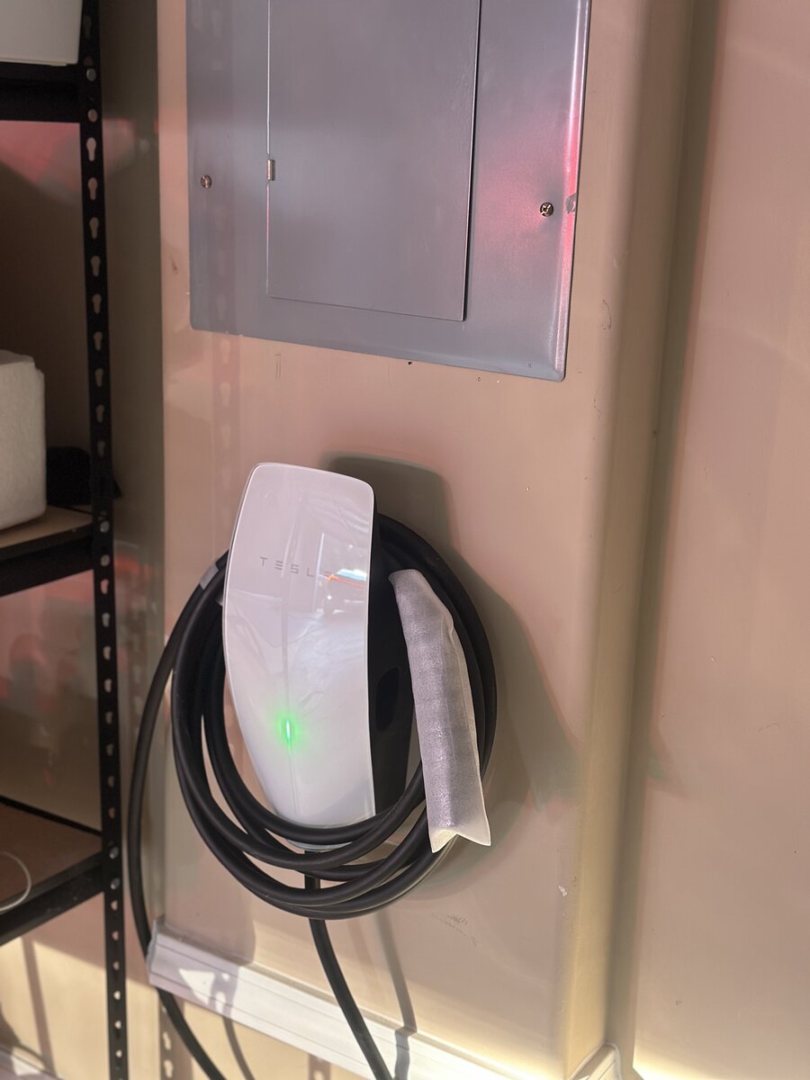 Finished Tesla charger install showing neat cable routing